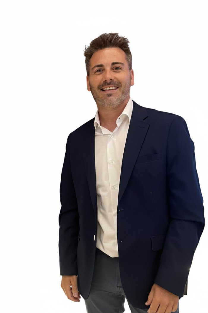 Diego Fuentes Lamoneda, smiling, in a navy blazer